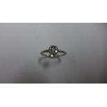 A hallmarked 18ct white gold diamond cluster ring, size L, head size approx 5mm, approx 2.5 grams,