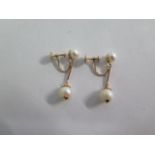 A 14ct yellow gold pearl drop earrings, 18mm drop, approx 3.4 grams, in good condition