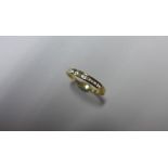 An 18ct yellow gold diamond band ring, size P, approx 2 grams, marked 18K, generally good condition