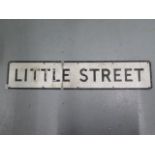 A metal street sign 'LITTLE STREET', 115cm x 23cm, crease cross 'Little' and some paint flaking,