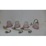 Four brass wall lights with Cranberry tinted shades, shades 12cm x 13cm, all in generally good