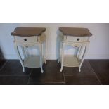 A pair of painted bedside tables each with a single drawer and under tier