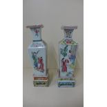 Two famille rose tapering square section vases on stands, 34cm tall, some small chips or frits