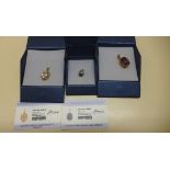 Three 9ct yellow gold GTV pendants, Fushie quartz, Rose quartz and tanzanite and snowflake Oboidian,