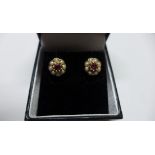 A pair of 9ct yellow gold tournmaline and pearl earrings, approx 7mm wide, approx 2 grams, in good