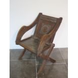 A Victorian oak carved Abbotts chair, 90cm tall x 68cm wide x 70cm deep, general wear and