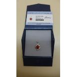 An 18ct white gold GTV Padparadocha sapphire and diamond pendant, metal weight approx 3.28 grams,