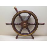 A WWII ships wheel with Admiralty label, 50cm wide, missing one piece