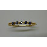 An 18ct yellow gold sapphire and diamond hinged bangle, 6cm x 6.8cm external, sapphires approx 6mm x