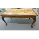 A mahogany library table with a leather inset top on carved cabriole legs, 77cm tall x 166cm x 91cm,