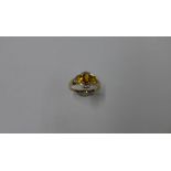 An Art Deco style Luke Stockley hallmarked 9ct yellow gold citrine, topaz and diamond ring with