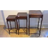 A set of three graduating chinese hardwood side tables with a carved frieze, tallest 62cm x 33cm