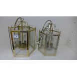 A brass hexagonal hall lantern, 37cm x 25cm, and a similar smaller silvered lantern