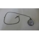 A silver and gilt pocket watch and chain - approx weight 60 grams - no key but runs