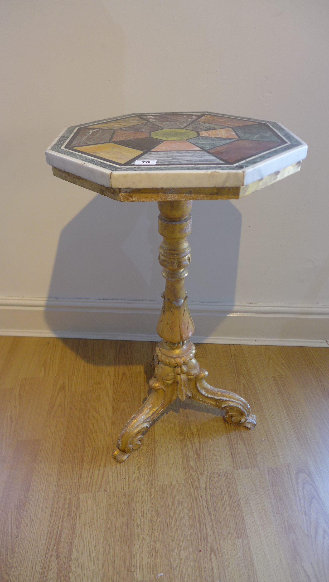 A gilt painted tripod statue jardinere stand with an octagonal specimen marble top, 79cm tall x 44cm