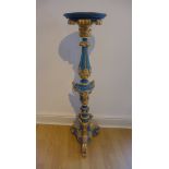A gilt and blue painted gesso statue or torchere stand, 112cm tall, top 25cm diameter, overpainted
