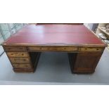 A late Victorian mahogany twin pedestal partners desk with an arrangement of 6 drawers and a