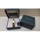 A ladies gold plated Gucci 1500L quartz watch with mother of pearl dial, with box and papers, not