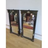 A pair of Empire 19th century ebonised pier mirrors with porcelain plaques and ormolu mounts - 104cm