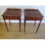 A pair of crossband lamp tables with a single drawer on turned reeded legs made by a local craftsman