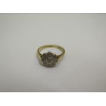 A hallmarked 18ct yellow gold diamond daisy ring size K with deceptive setting - approx weight 2.5