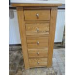 A modern oak five drawer Wellington type chest - Height 101cm x 54cm x 35cm