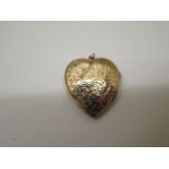 A 9ct gold plated back and front heart shaped locket - width 2.5cm