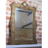 A gilt wall mirror with porcelain plaque - some gesso losses and cracking to gesso but a