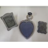 Two silver framed photograph frames, a silver top and a damaged silver and enamel card case -
