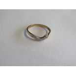 A 9ct yellow gold diamond ring, not hallmarked but old, test mark to inside of shank, size N, approx