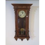 A walnut double weight striking Vienna wall clock