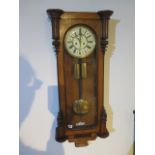 A walnut double weight striking Vienna wall clock - Height 99cm