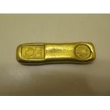 A gilt metal trade weight - approx 199 grams
