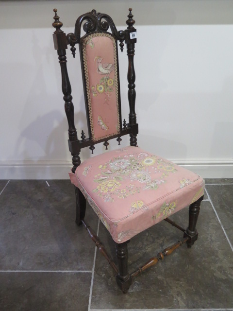 An ornate Victorian mahogany parlour chair - in sturdy condition