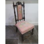 An ornate Victorian mahogany parlour chair - in sturdy condition