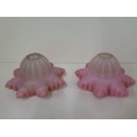 A pair of pink glass light shades - Width 15cm x Height 9cm - both generally good
