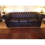 A Thomas Lloyd leather Chesterfield settee sofa bed - as new, only a few months old