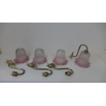 Four brass wall lights with Cranberry tinted shades, shades 12cm x 13cm, all in generally good