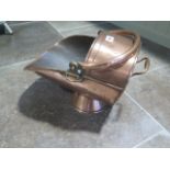 A 19th century copper coal scuttle