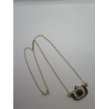 A yellow gold diamond and jade pendant 33mm x 20mm on a 9ct yellow gold chain 46cm long, pendant