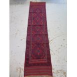 A hand knotted woollen Meshwani runner - 241cm x 57cm