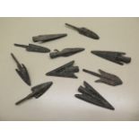 A collection of ten assorted metal replica arrowheads