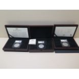 Three boxed silver coins - 1921 Morgan Dollar, 1937 George VI Coronation Crown and a 1935 George V