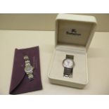 A Burberry gents quartz bracelet watch and a ladies quartz bracelet watch with a box and pouch -