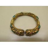 A gilt metal dragon bangle - 8cm x 7cm