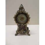 A small clock made by The British United Clock Co Birmingham - tortoiseshell covering with brass