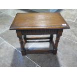 A 17th century style carved oak joined stool in polished condition - Height 42cm x 48cm x 30cm