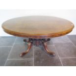 A Victorian burr walnut oval tilt top breakfast table on four scroll supports - Height 73cm x