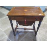 A late Victorian/Edwardian work table with drawer and basket, mahogany with inlay, with some