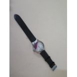 A stainless steel quartz wristwatch - Case width 4cm - with 3ct of small rubies floating in the dial